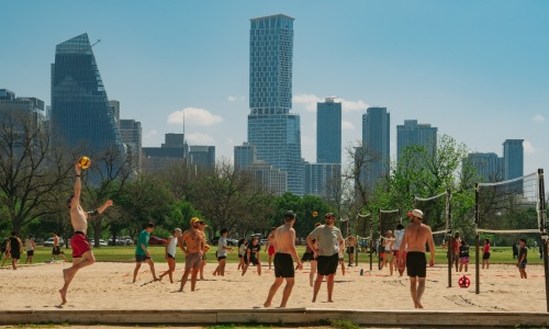 people playing volleyball in a city